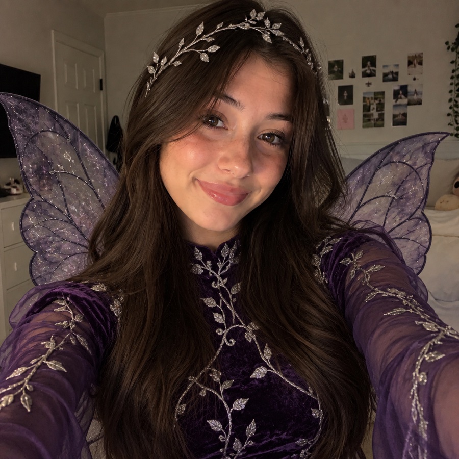 The same AI avatar in a dark fairy costume