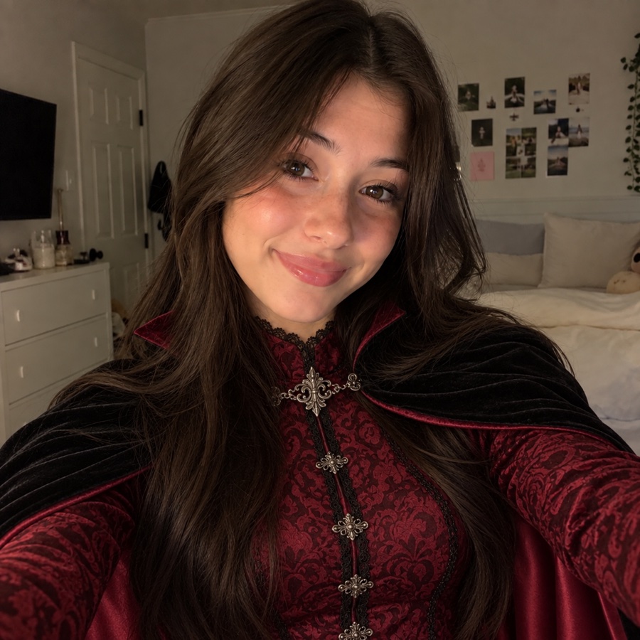 The same AI avatar in a vampire costume